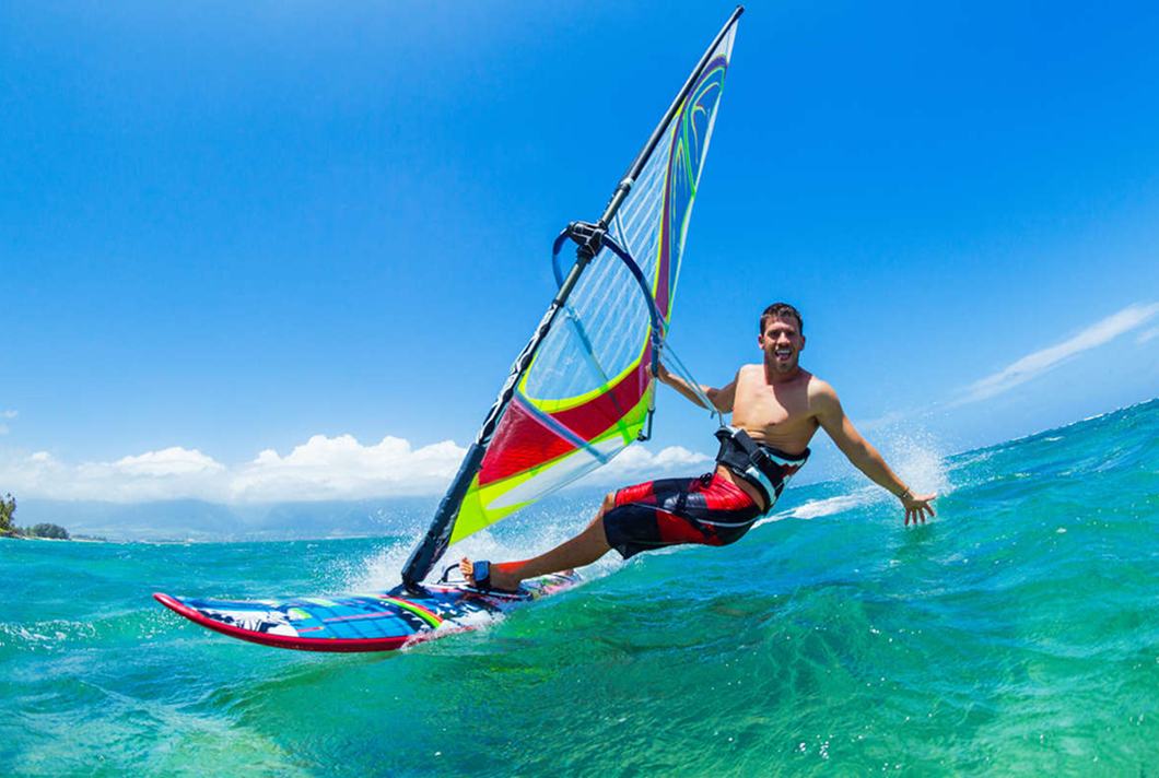 Windsurfer smiling on turquoise water